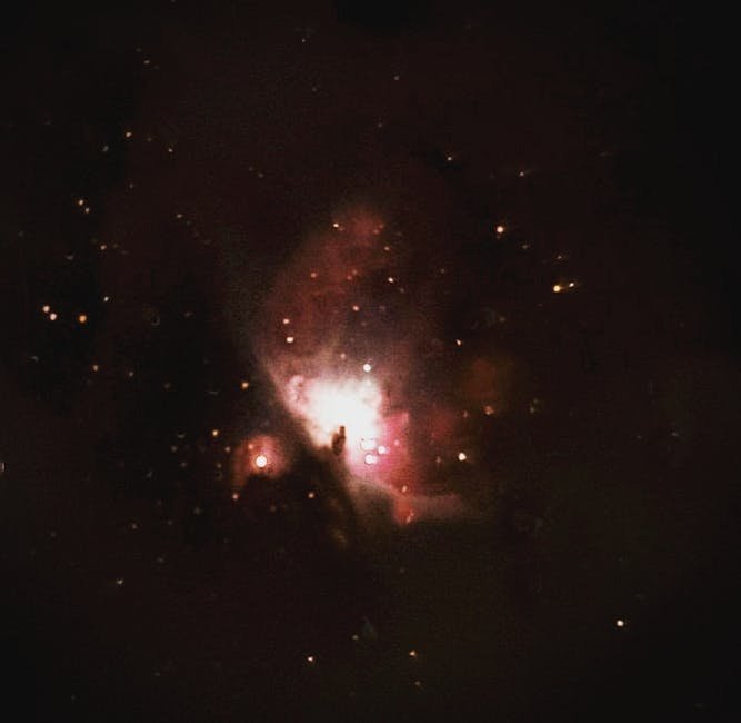 Capture of a vibrant nebula amidst a starry night sky, featuring soft glowing light and cosmic dust.