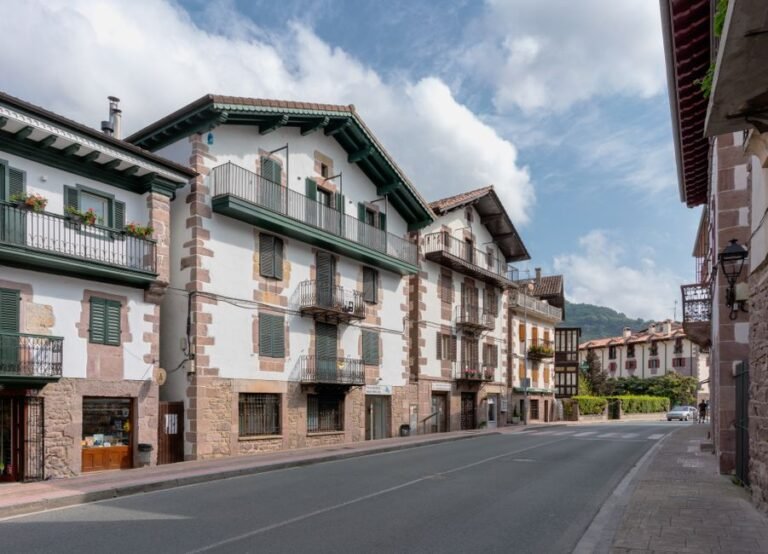 Scenic view of traditional stone buildings on a quiet street in Elizondo, Spain.