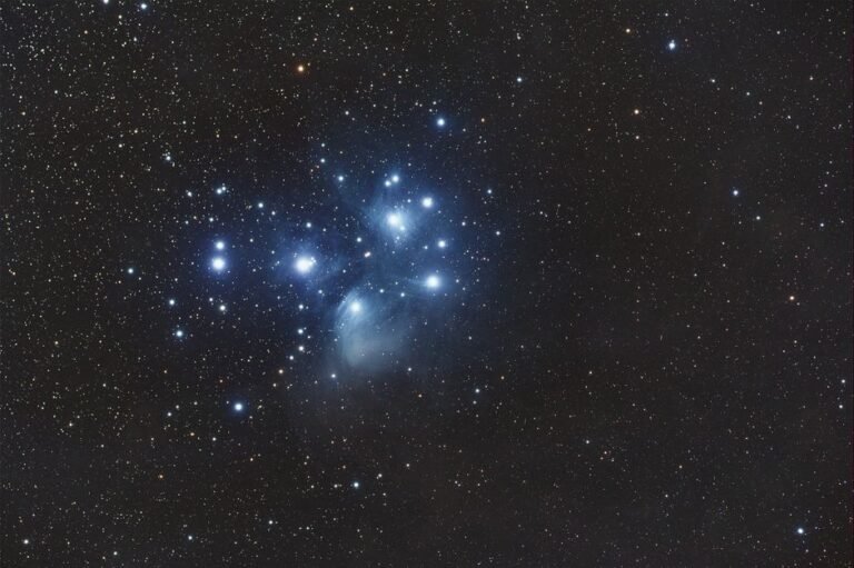 Captivating image of the Pleiades star cluster illuminating the night sky with a stunning cosmic display.