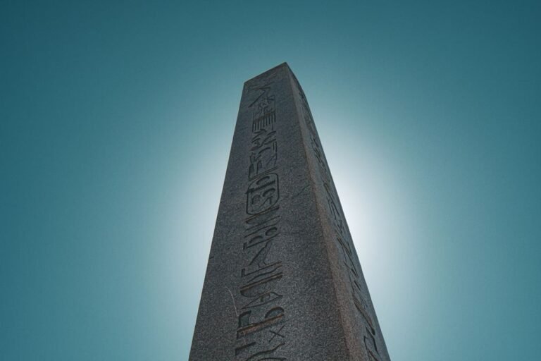 Ancient Theodosius Obelisk against clear blue sky in İstanbul, Türkiye.