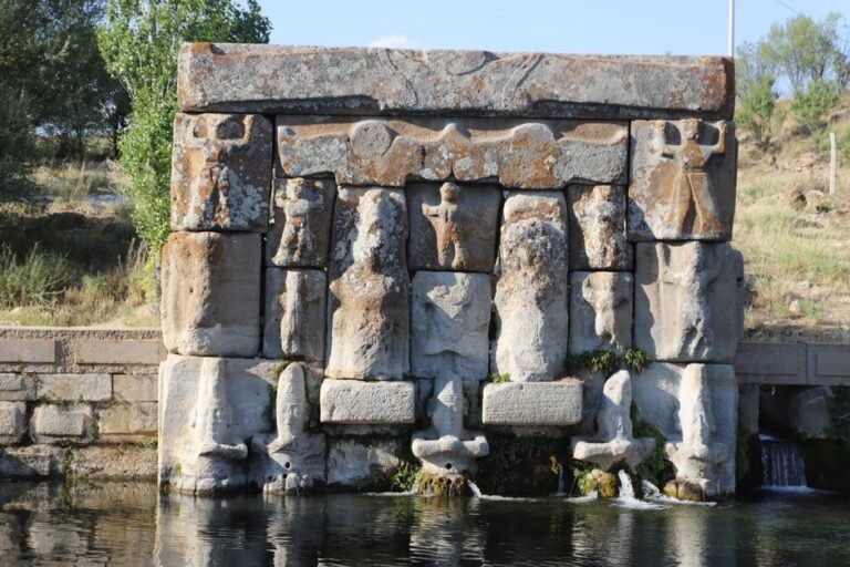 Ancient stone carvings at a Hittite monument reflecting historical art in Turkey.