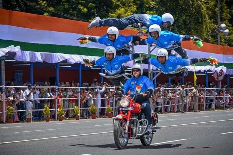 Motorcycle stunt performers in uniform at a parade showcasing impressive formations.