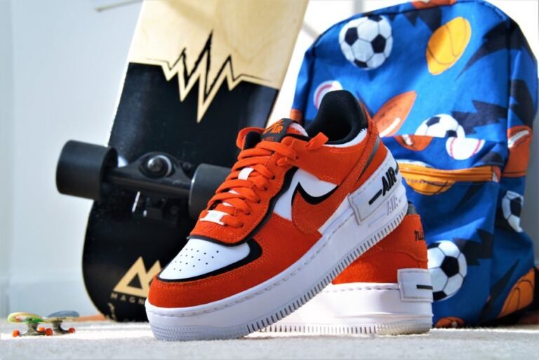 Dynamic photo of red sneakers, skateboard, and sporty backpack showcasing vibrant colors and modern lifestyle.